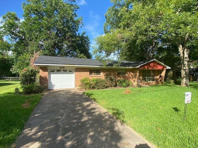 single story home featuring a garage, aphalt driveway, fence, a front yard, and brick siding