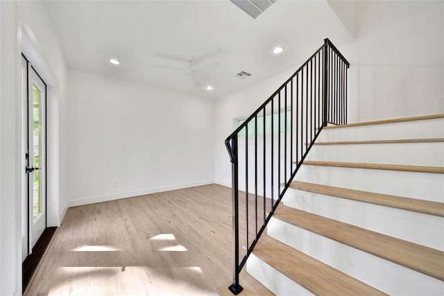 stairway with a ceiling fan, visible vents, recessed lighting, and a healthy amount of sunlight