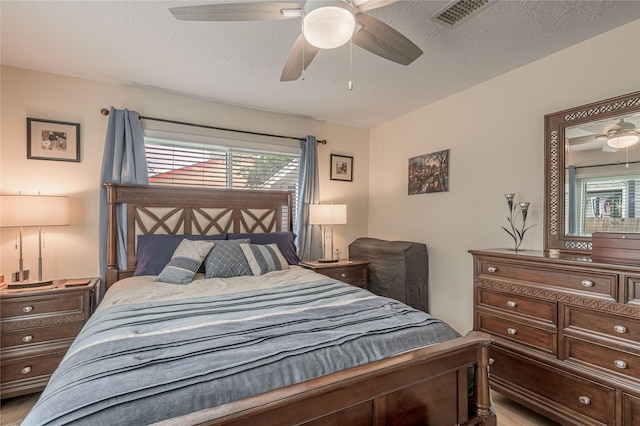 bedroom featuring visible vents and a ceiling fan