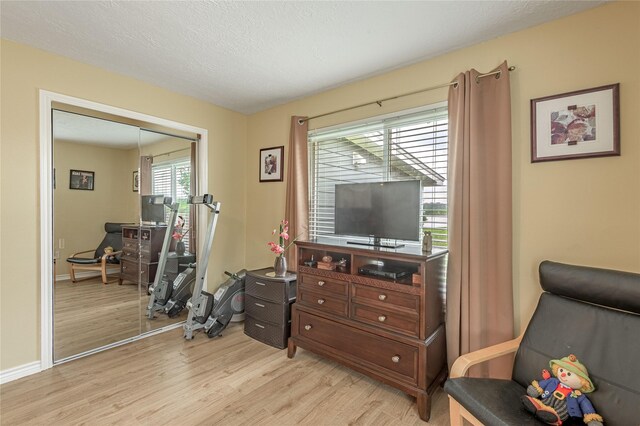 sitting room featuring light wood-style floors and baseboards