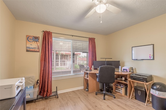 office area featuring baseboards, wood finished floors, a textured ceiling, and ceiling fan