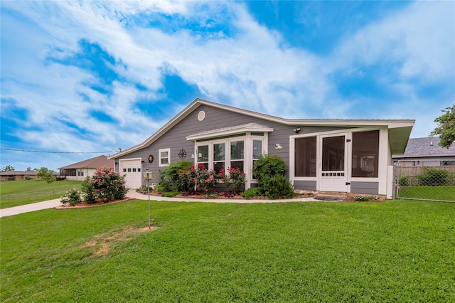 ranch-style house with concrete driveway, fence, a garage, a sunroom, and a front yard