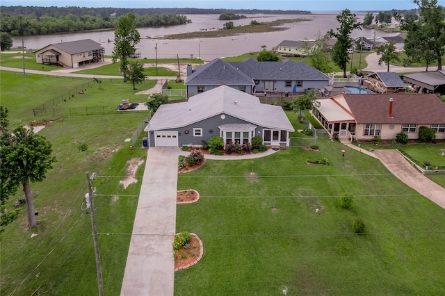bird's eye view with a residential view and a water view