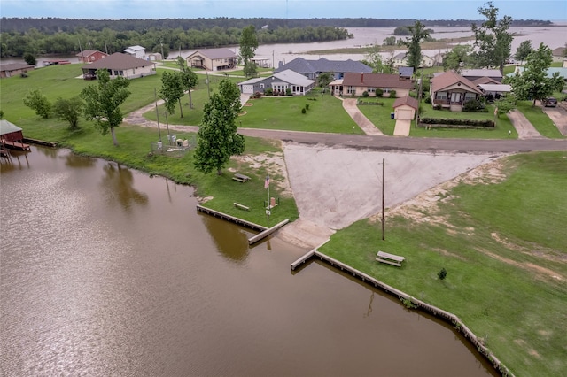 drone / aerial view with a residential view and a water view