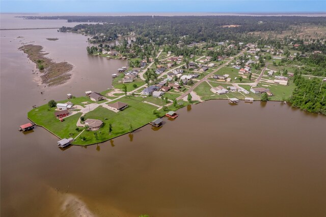 drone / aerial view with a residential view and a water view