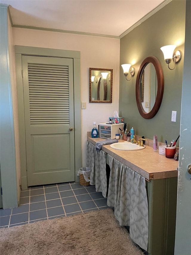 bathroom featuring tile patterned floors, vanity, and crown molding