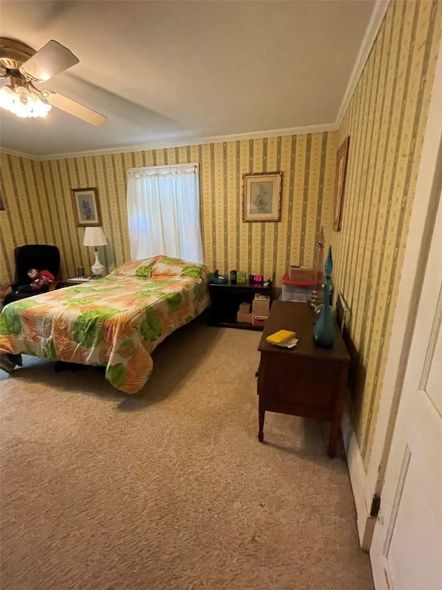 bedroom featuring wallpapered walls, ceiling fan, carpet flooring, and ornamental molding