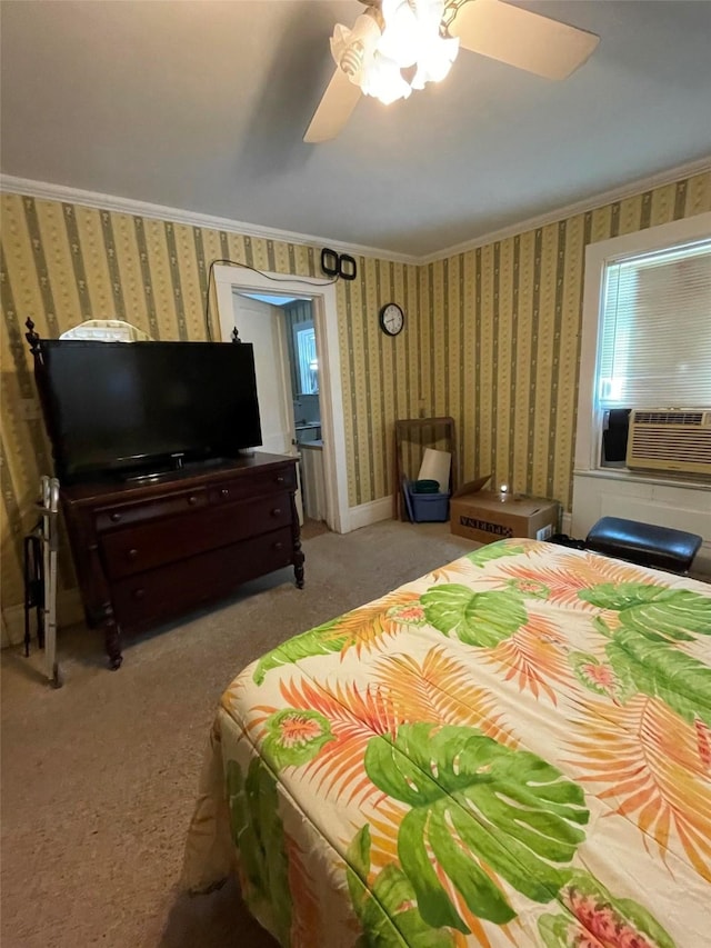bedroom featuring wallpapered walls, cooling unit, ceiling fan, ornamental molding, and carpet flooring