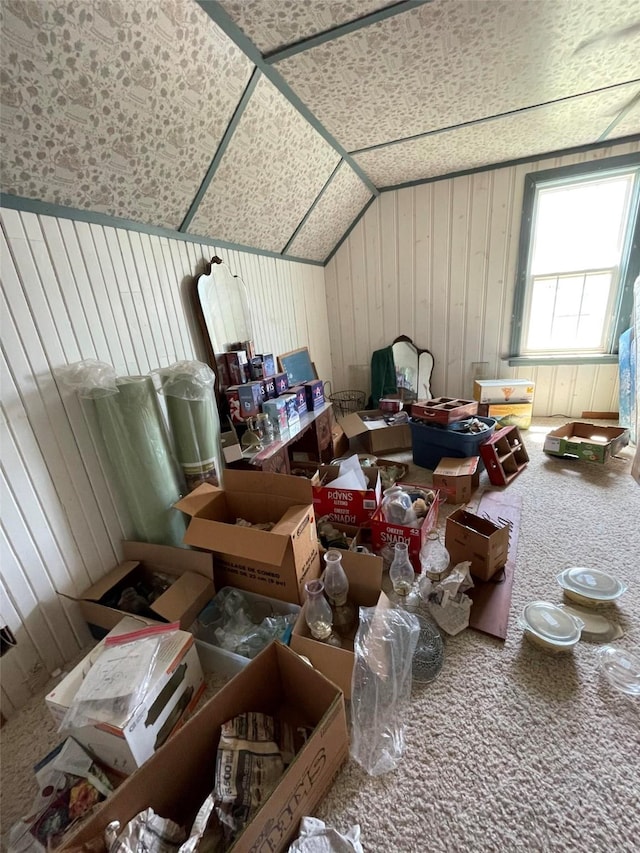 bonus room featuring vaulted ceiling and carpet floors