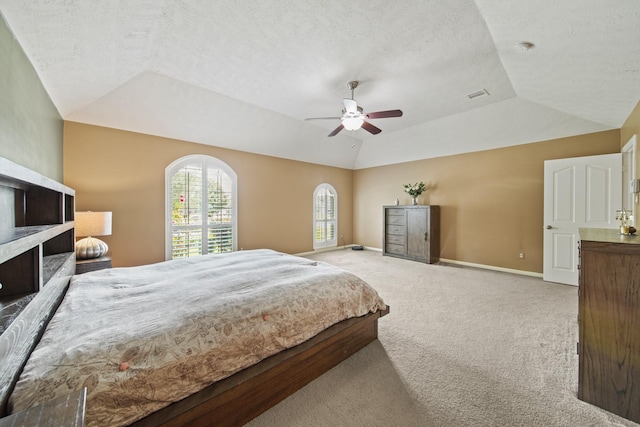 1704 Tempe St, League City, TX 77573 - bedroom featuring carpet, lofted ceiling, baseboards, ceiling fan, and a fireplace