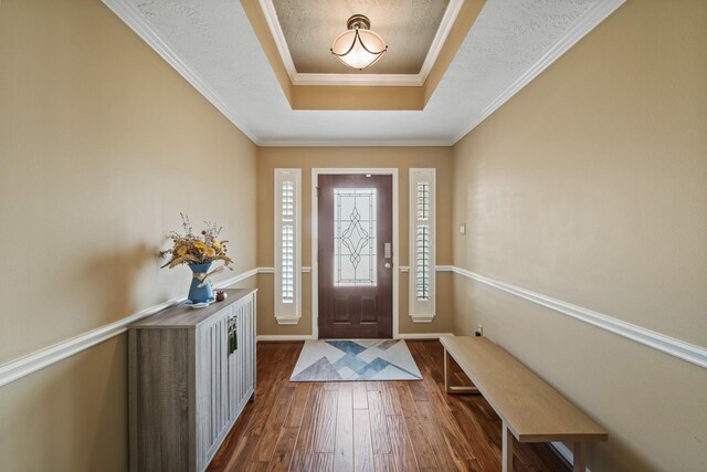 1704 Tempe St, League City, TX 77573 - entrance foyer with a raised ceiling, dark wood finished floors, and baseboards