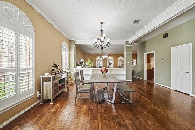 1704 Tempe St, League City, TX 77573 - dining space featuring a chandelier, hardwood / wood-style floors, crown molding, and baseboards
