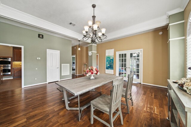 1704 Tempe St, League City, TX 77573 - dining area featuring a chandelier, dark wood-style floors, french doors, crown molding, and baseboards