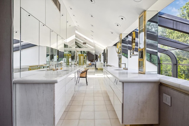 interior space featuring light countertops, light tile patterned flooring, white cabinetry, and modern cabinets