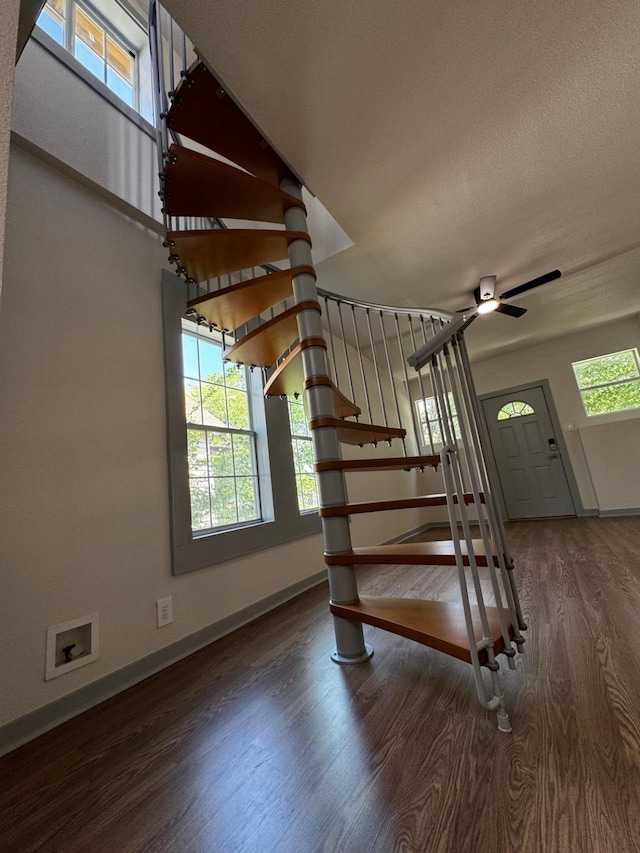 3401 Illinois St, Baytown, TX 77520 - stairs with baseboards, a ceiling fan, and wood finished floors