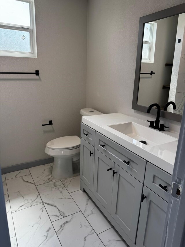 3401 Illinois St, Baytown, TX 77520 - bathroom with vanity, plenty of natural light, and marble finish flooring
