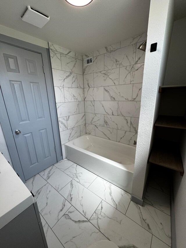3401 Illinois St, Baytown, TX 77520 - full bath featuring marble look tiles, bathing tub / shower combination, and vanity