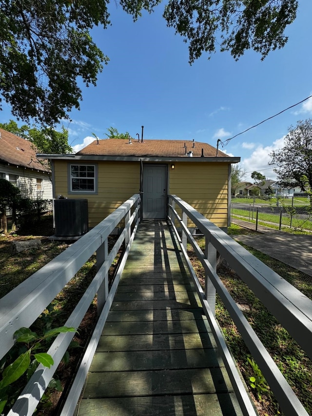 3401 Illinois St, Baytown, TX 77520 - rear view of house featuring central air condition unit and fence