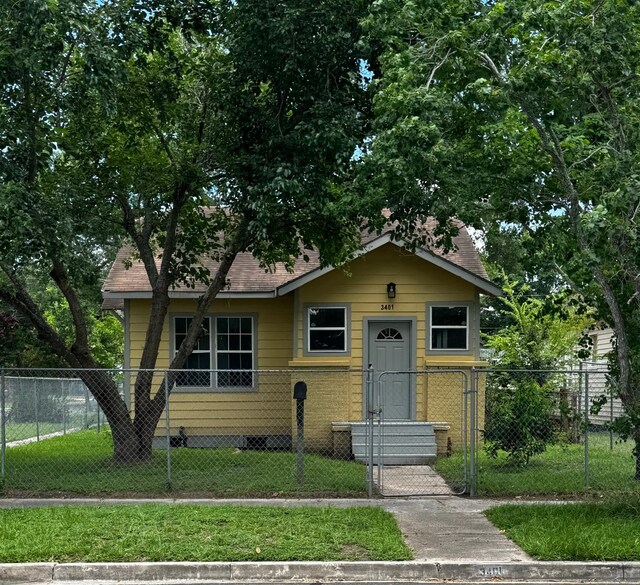 3401 Illinois St, Baytown, TX 77520 - view of front of property featuring a fenced front yard and a gate