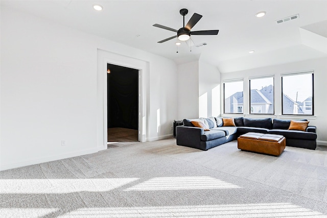 living room featuring baseboards, carpet flooring, and visible vents