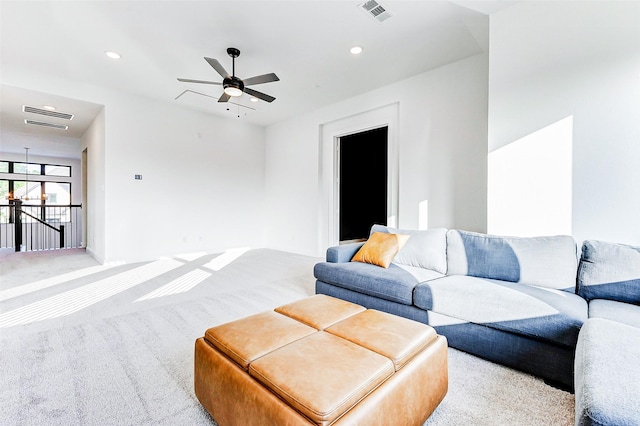 carpeted living room with recessed lighting, ceiling fan, and visible vents