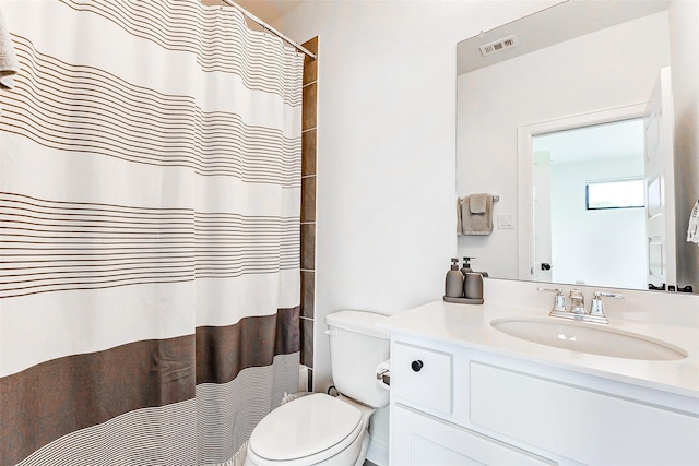 bathroom with toilet, a shower with curtain, visible vents, and vanity