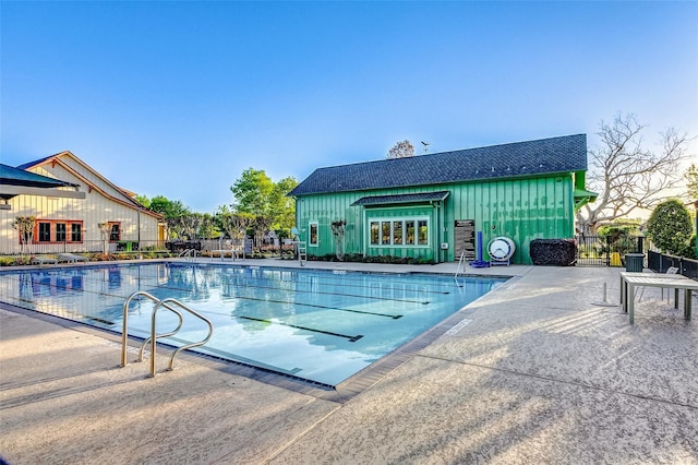 pool featuring a patio and fence