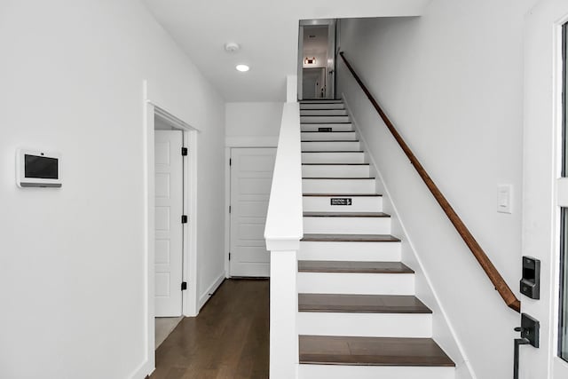 stairs with recessed lighting, wood finished floors, and baseboards