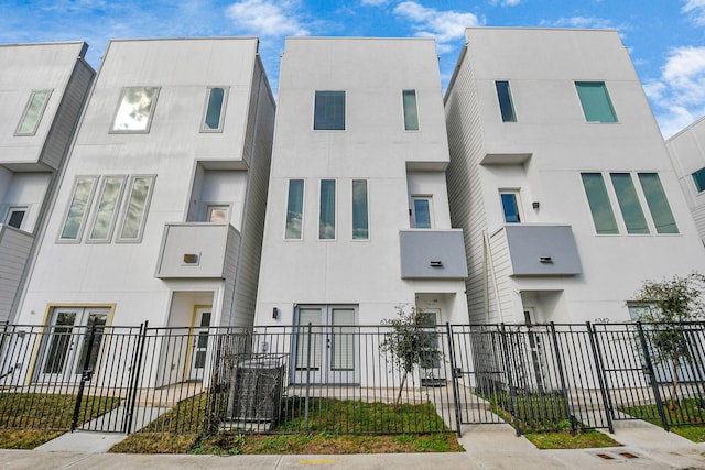 view of building exterior with a fenced front yard