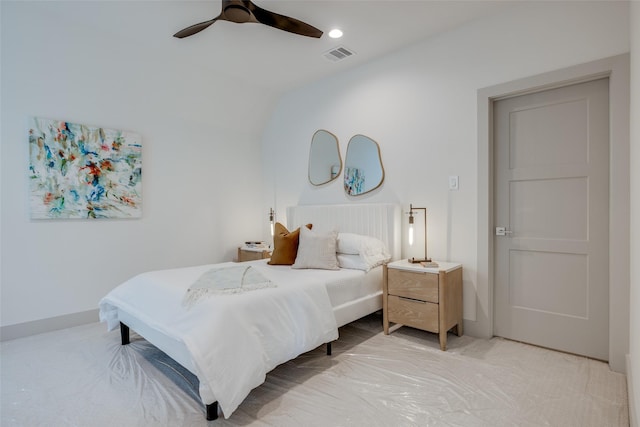 bedroom with baseboards, visible vents, light colored carpet, lofted ceiling, and ceiling fan