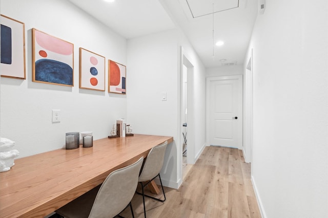 interior space with attic access, baseboards, recessed lighting, and light wood-style flooring