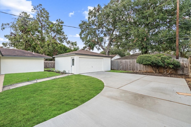 detached garage featuring fence