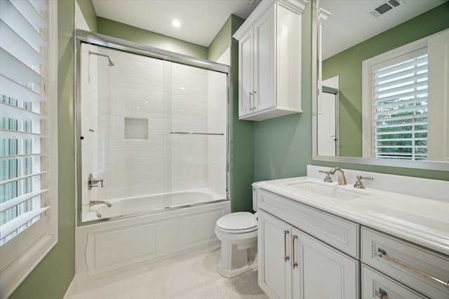 305 Royale Heights Ln, Houston, TX 77024 - full bath with vanity, enclosed tub / shower combo, toilet, visible vents, and recessed lighting