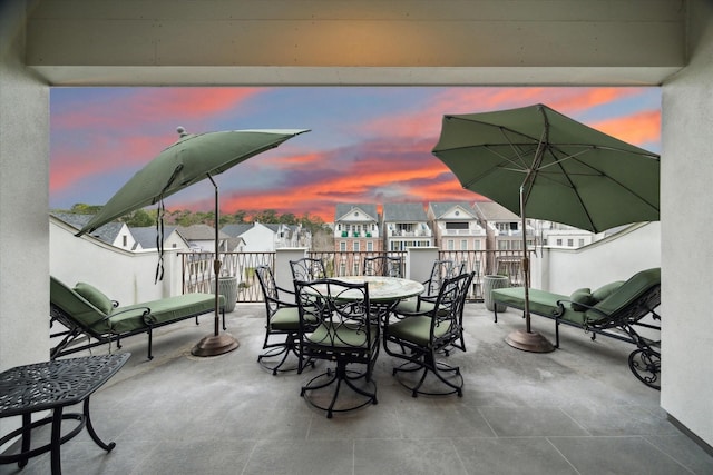 305 Royale Heights Ln, Houston, TX 77024 - patio terrace at dusk with outdoor dining area and a residential view