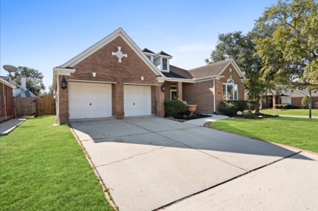 7103 Hot Creek Trce, Humble, TX 77346 - traditional-style house featuring brick siding, an attached garage, and driveway