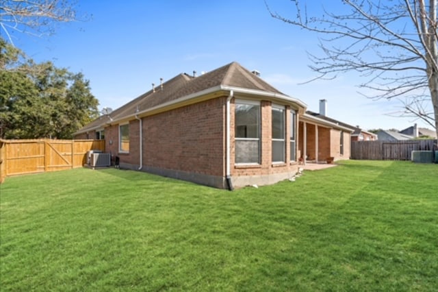 7103 Hot Creek Trce, Humble, TX 77346 - back of property with brick siding and cooling unit