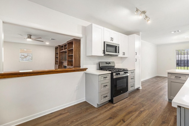 1510 Tarberry Rd, Houston, TX 77088 - kitchen with appliances with stainless steel finishes, dark wood-style floors, and light countertops