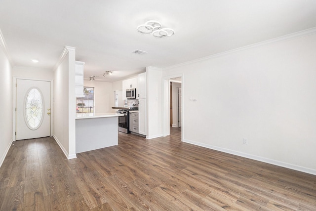 1510 Tarberry Rd, Houston, TX 77088 - unfurnished living room with ornamental molding, dark wood-type flooring, and baseboards