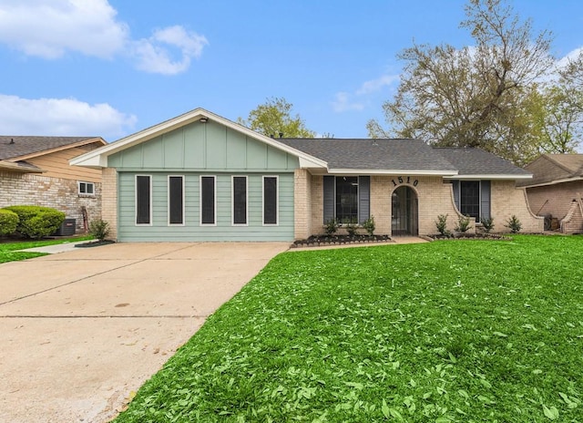 1510 Tarberry Rd, Houston, TX 77088 - single story home featuring board and batten siding, concrete driveway, a front yard, and brick siding