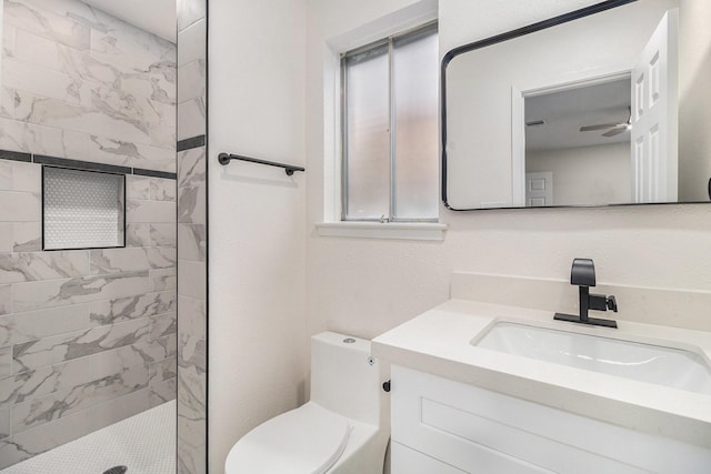 1510 Tarberry Rd, Houston, TX 77088 - bathroom featuring a tile shower, vanity, toilet, and a ceiling fan