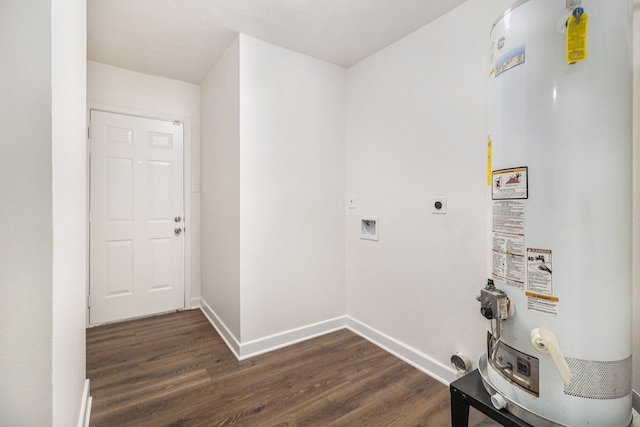 1510 Tarberry Rd, Houston, TX 77088 - washroom featuring gas water heater, electric dryer hookup, dark wood-style flooring, and baseboards