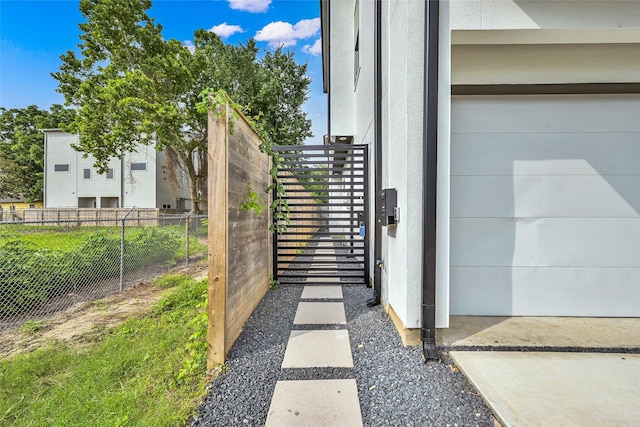 view of gate with fence