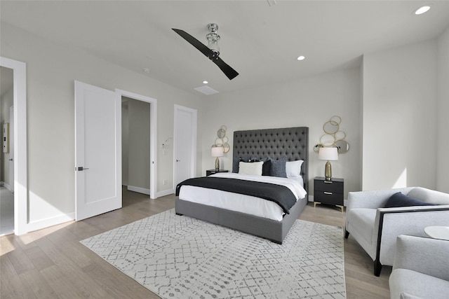 bedroom featuring recessed lighting, a ceiling fan, wood finished floors, and baseboards