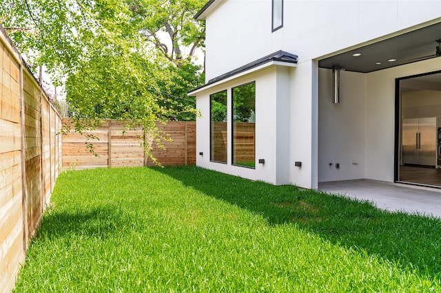 2222 Branard St, Houston, TX 77098 - view of yard featuring a patio and a fenced backyard