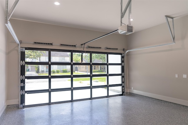 2222 Branard St, Houston, TX 77098 - garage with recessed lighting, a garage door opener, and baseboards
