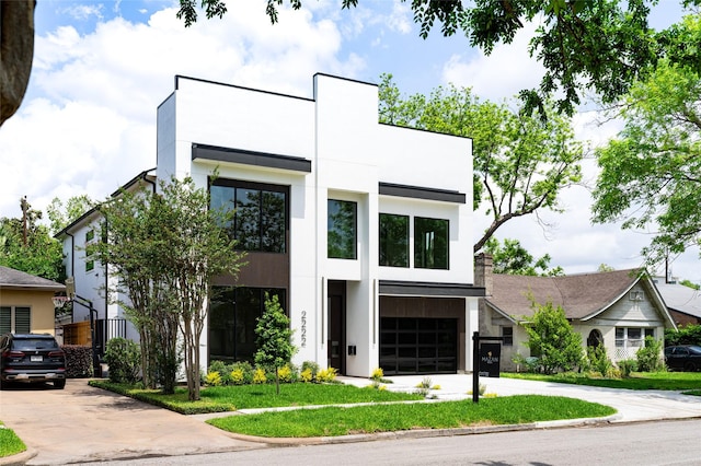 2222 Branard St, Houston, TX 77098 - modern home with a garage, stucco siding, and concrete driveway
