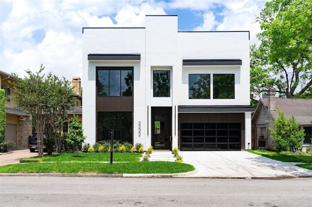 2222 Branard St, Houston, TX 77098 - contemporary house with stucco siding, concrete driveway, and a garage