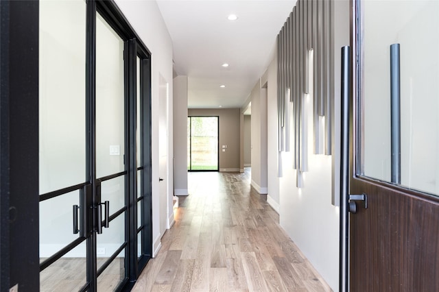 2222 Branard St, Houston, TX 77098 - corridor featuring recessed lighting, light wood-style flooring, and baseboards