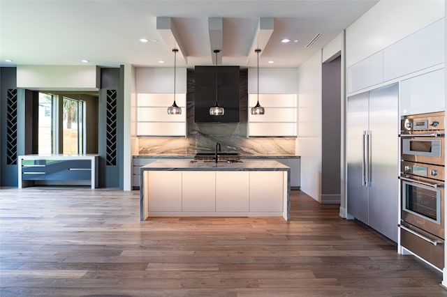 2222 Branard St, Houston, TX 77098 - kitchen with a sink, modern cabinets, appliances with stainless steel finishes, and a warming drawer