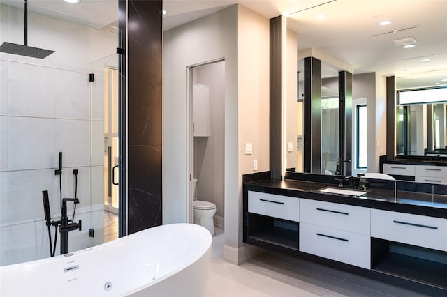 2222 Branard St, Houston, TX 77098 - bathroom with recessed lighting, a shower stall, vanity, toilet, and a freestanding bath